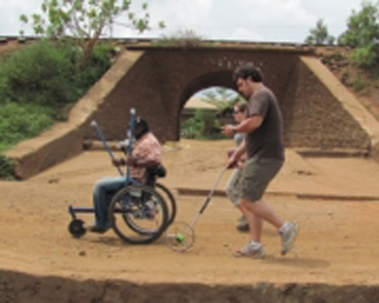 Amos Winter, right, spent three weeks in January testing the Leveraged Freedom Chair in East Africa. Photo: Joseph Kisyoky