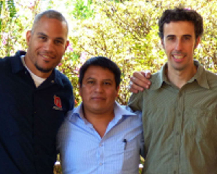 Victor (right) with D-Lab Associate Director Kofi Taha (left) and a SolCom partner (center).
