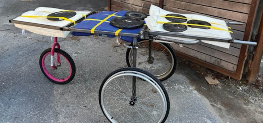 Initial load testing of the prototyped stretcher design in the courtyard outside of D-Lab. Photo: Courtesy MIT D-Lab