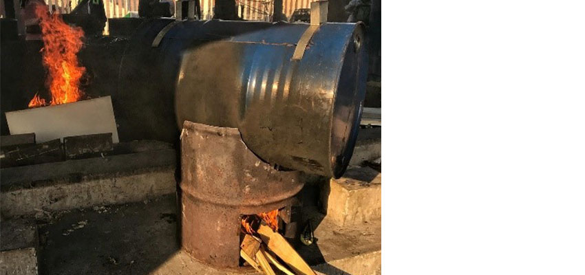 Mealie cooking tests done on-site with mealie cookers, and image showing draining boiling from the cooking drum, after the cooking test - 1.