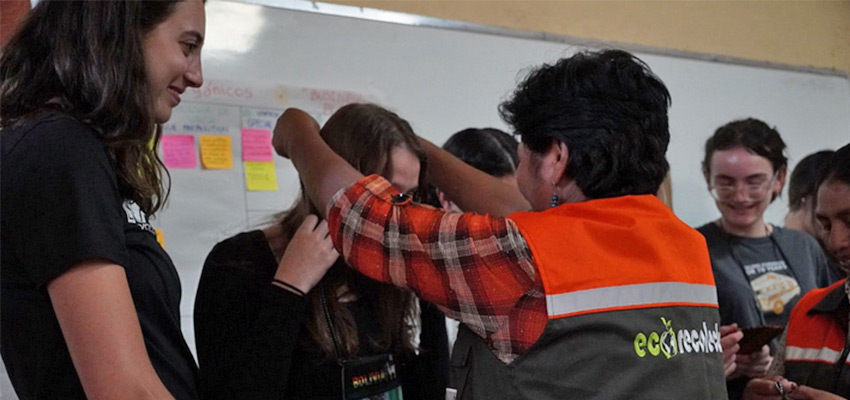 A person placing something over the head of another person