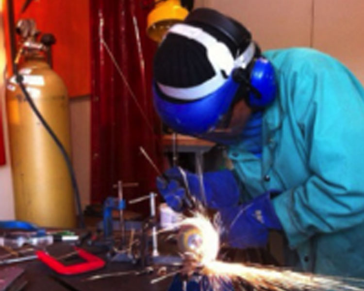Netia welding in the D-Lab shop. 