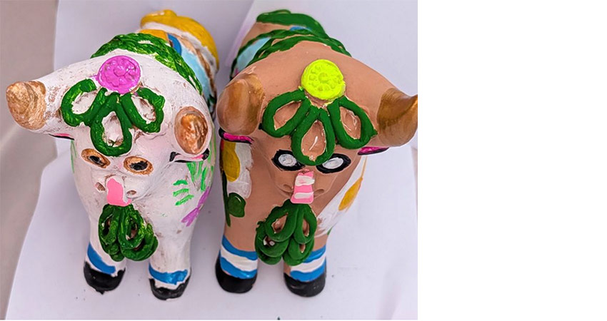A pair of painted terracotta animal figures.